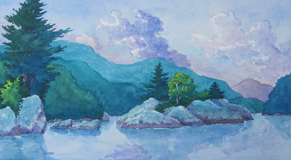 A small rocky island framed reflecting in the water and framed by the distant hills.